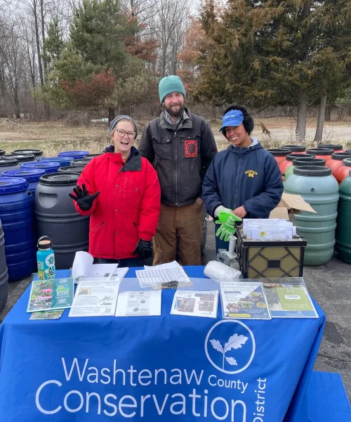 staff with rain barrels