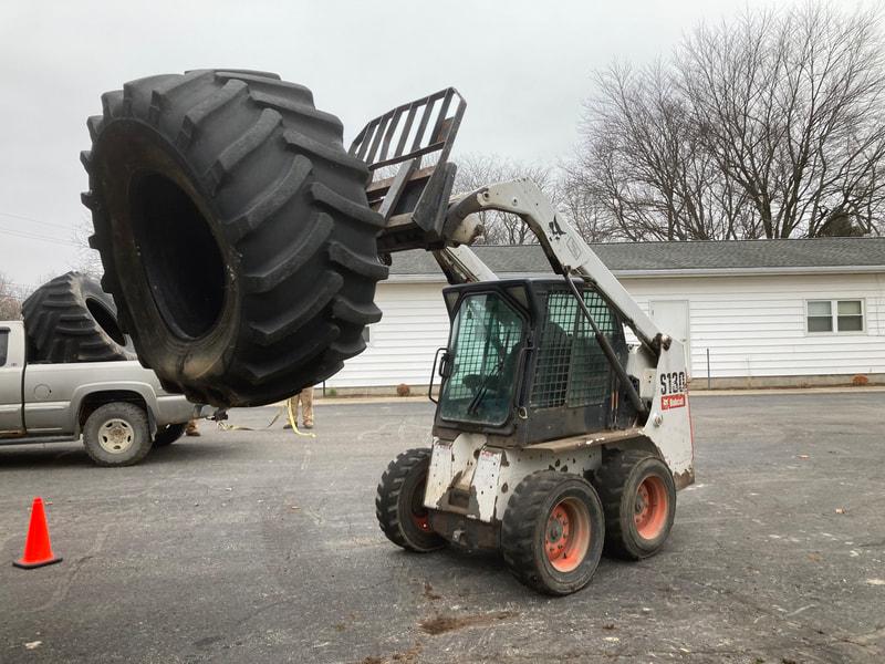 tractor tires being loaded
