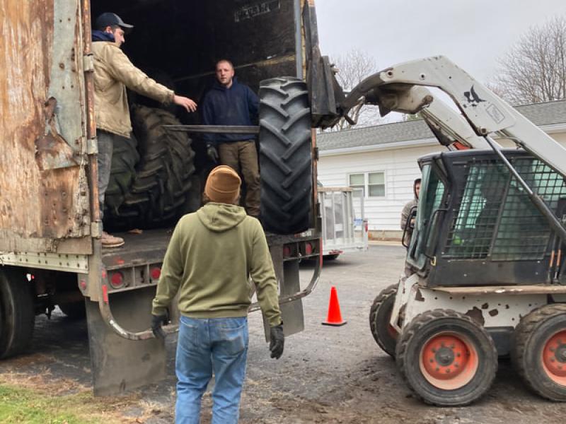 tractor tires loading into semi trailer