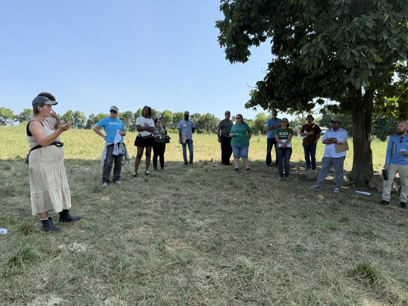 Malaika Whitney speaking at Whitney farmstead in livestock fields