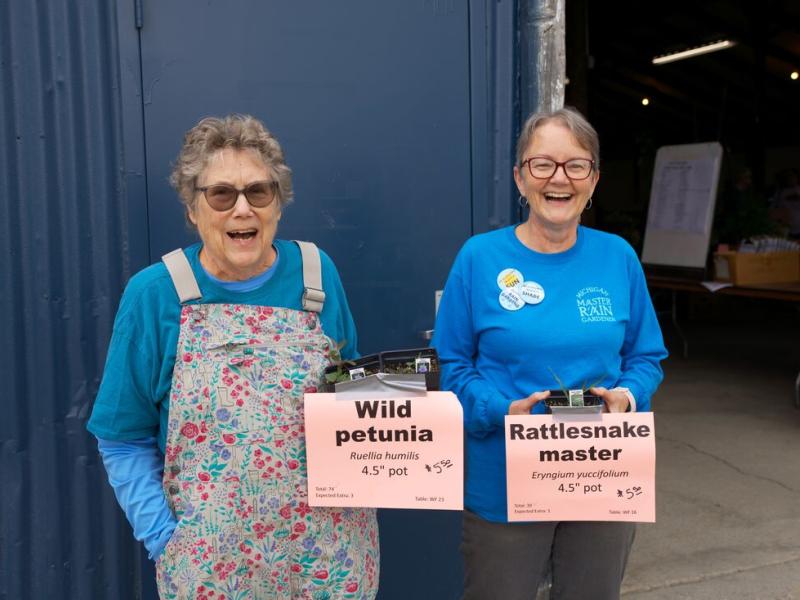 Volunteers with potted plants (Photo Credit: Paul Michael Peters)