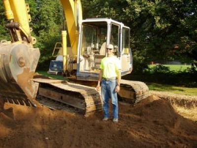 Mike Shepard Excavating, Inc. - pictured with Backhoe