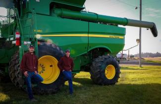 Brad and Jerry Bristle with a Combine