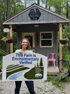 Farm Jill posing with MAEAP farm sign