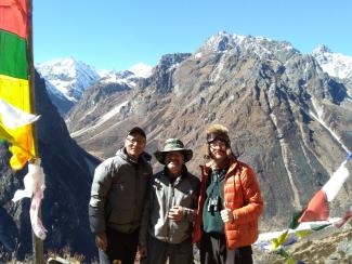 Three men standing in the mountains of Nepal