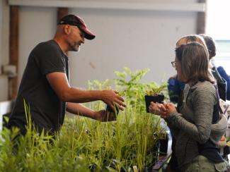 Brian from Designs By Nature nursery educates customers about plants (Photo Credit: Paul Michael Peters)