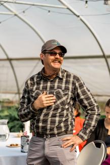 Man standing in a greenhouse