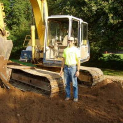 Mike Shepard Excavating, Inc. - pictured with Backhoe