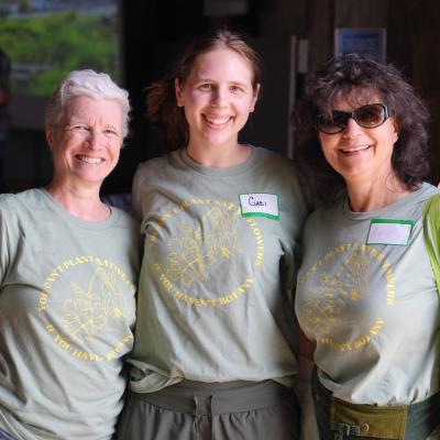 3 Smiling Volunteers with Expo event shirts