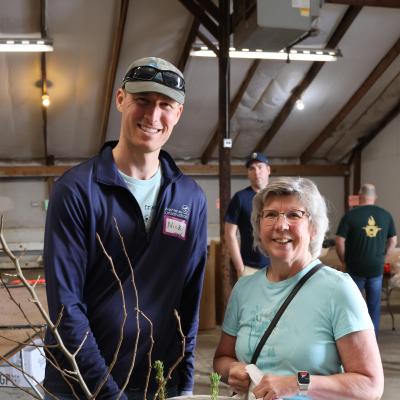 staff with tree sale customer