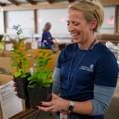 WCCD Staff holding native plant pots