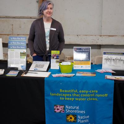 Anita from Huron River Watershed Council with educational materials (Photo Credit: Paul Michael Peters)