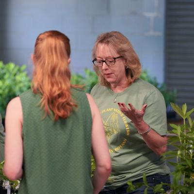 Volunteer discusses the 5 species of milkweed in the giveaway (Photo Credit: Paul Michael Peters)